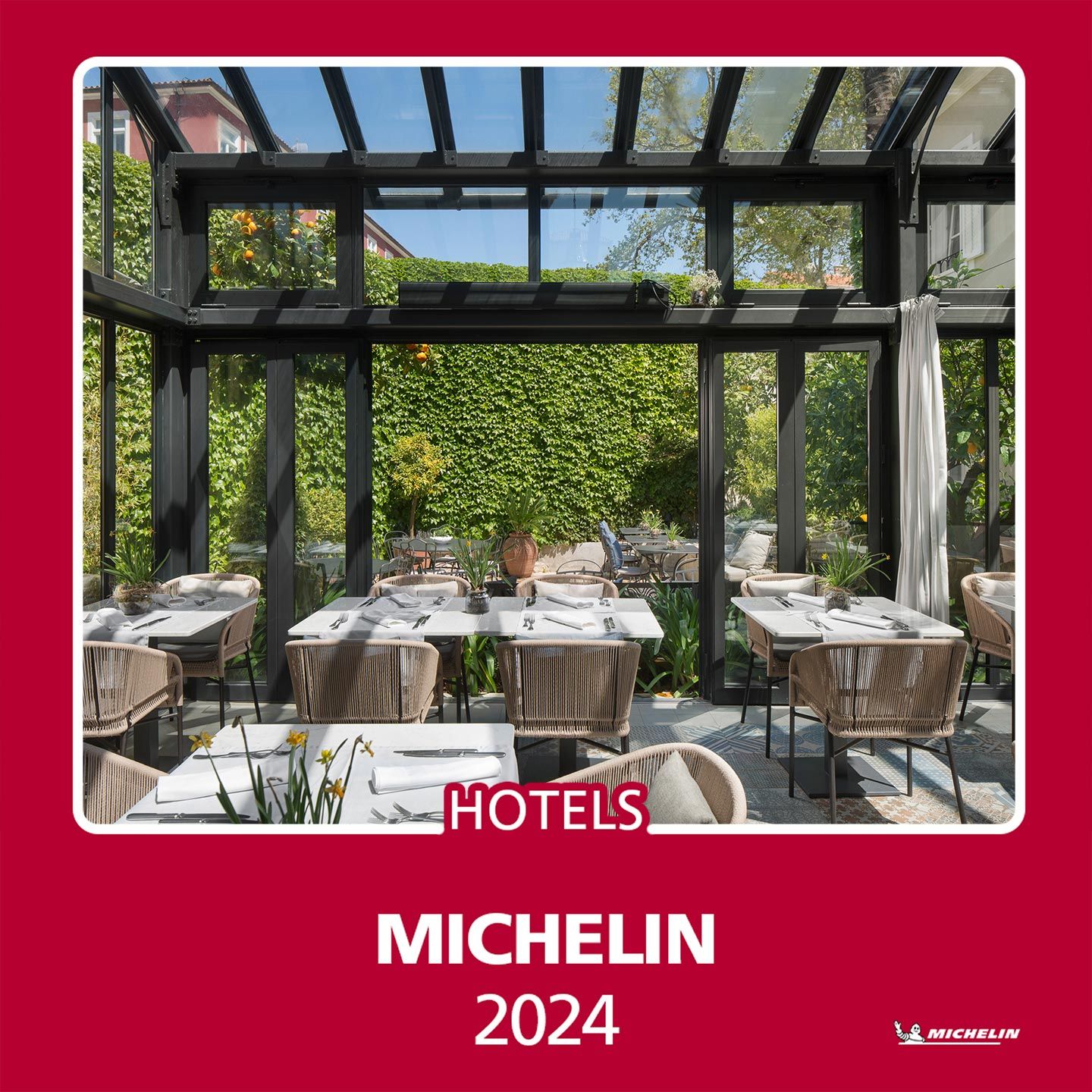 The Almayer's glass and steel Orangerie, surrounded by its secret garden, showcases the Michelin logo, which was celebrated in the 2024 Michelin Guide for outstanding hospitality.