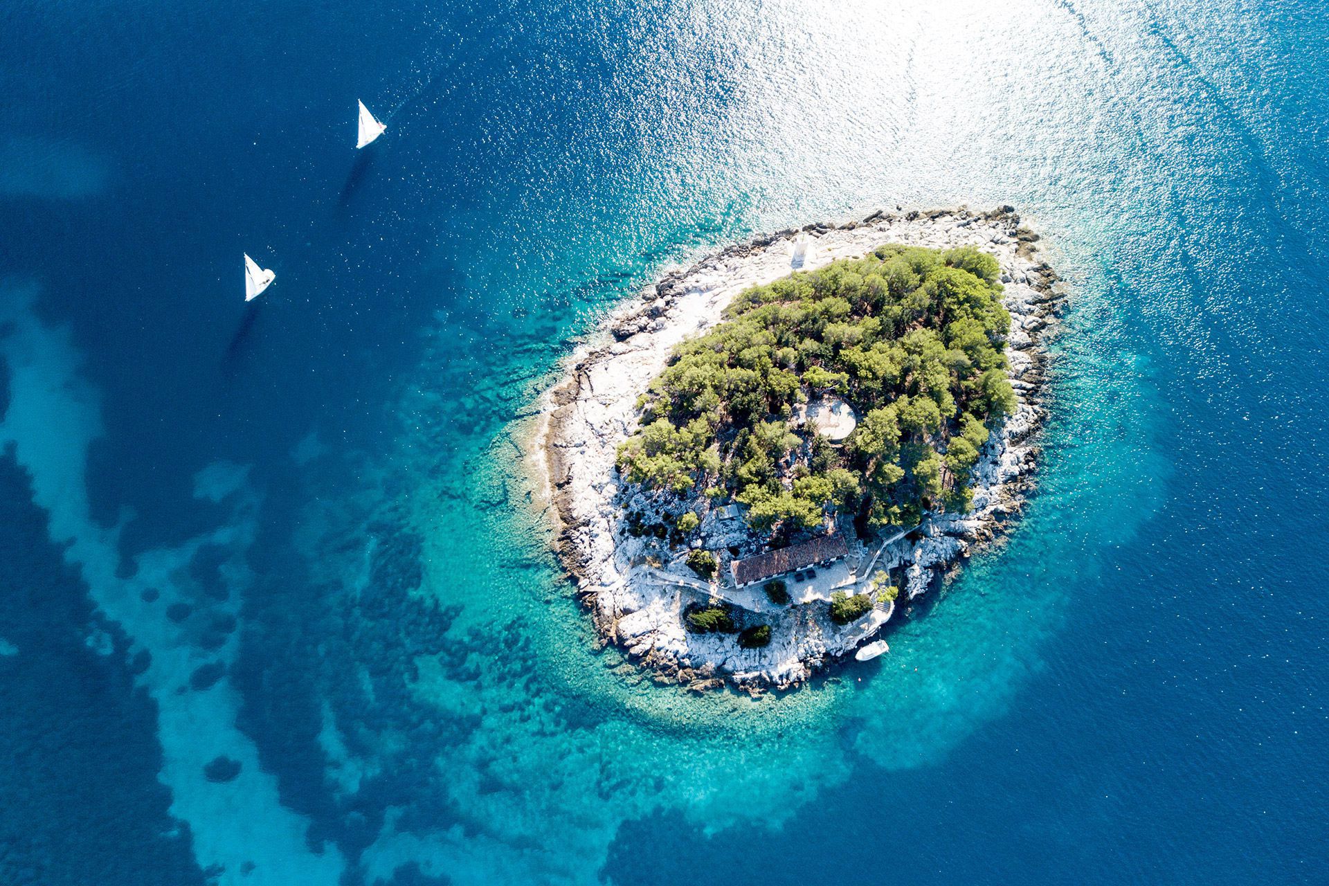 The turquoise Adriatic Sea in Zadar Archipelago and picturesque dalmatian island viewed from top