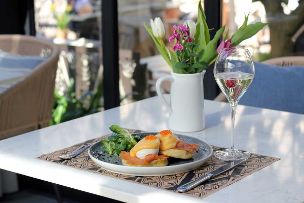 Indulge in delicious breakfast: Poached eggs Royale with smoked salmon and trout caviar at Corte Restaurant, Almayer Art & Heritage Hotel