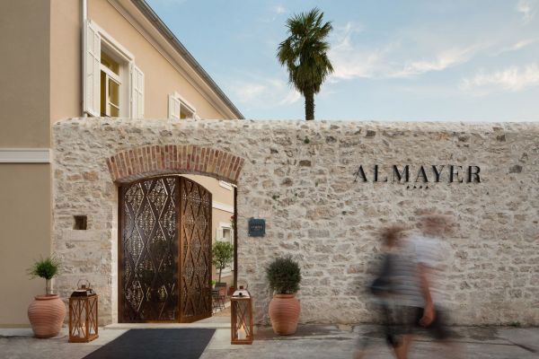 Almayer Art & Heritage Hotel's main building with old monastery wall and its iconic courtyard gates