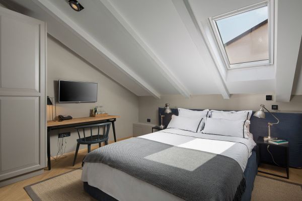 Experience romance and tranquillity in the warmth of our attic Standard double room 'La Settima Stanza' at Almayer Art & Heritage Hotel